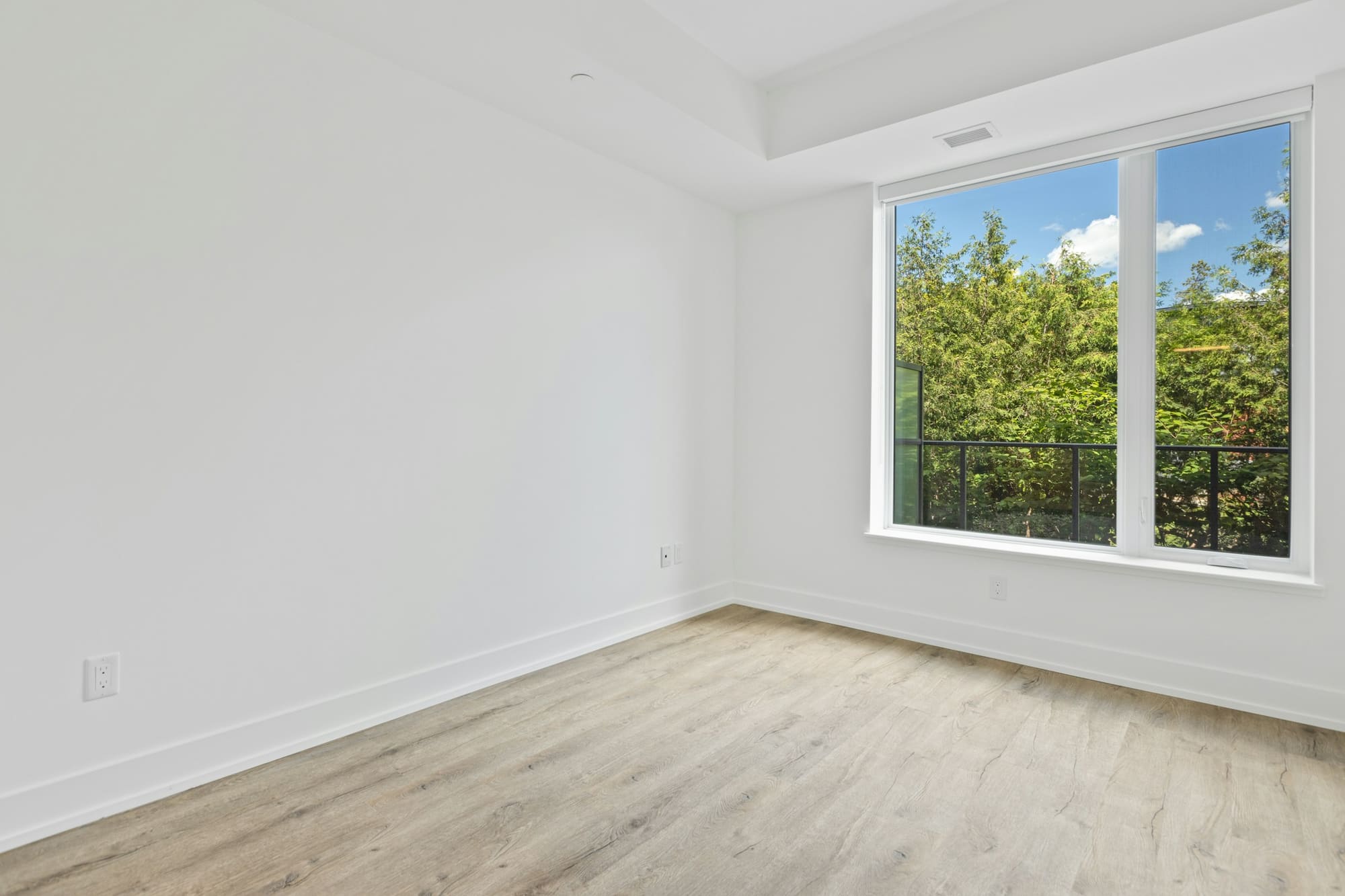 Bright interior with white walls, a smooth ceiling and natural light