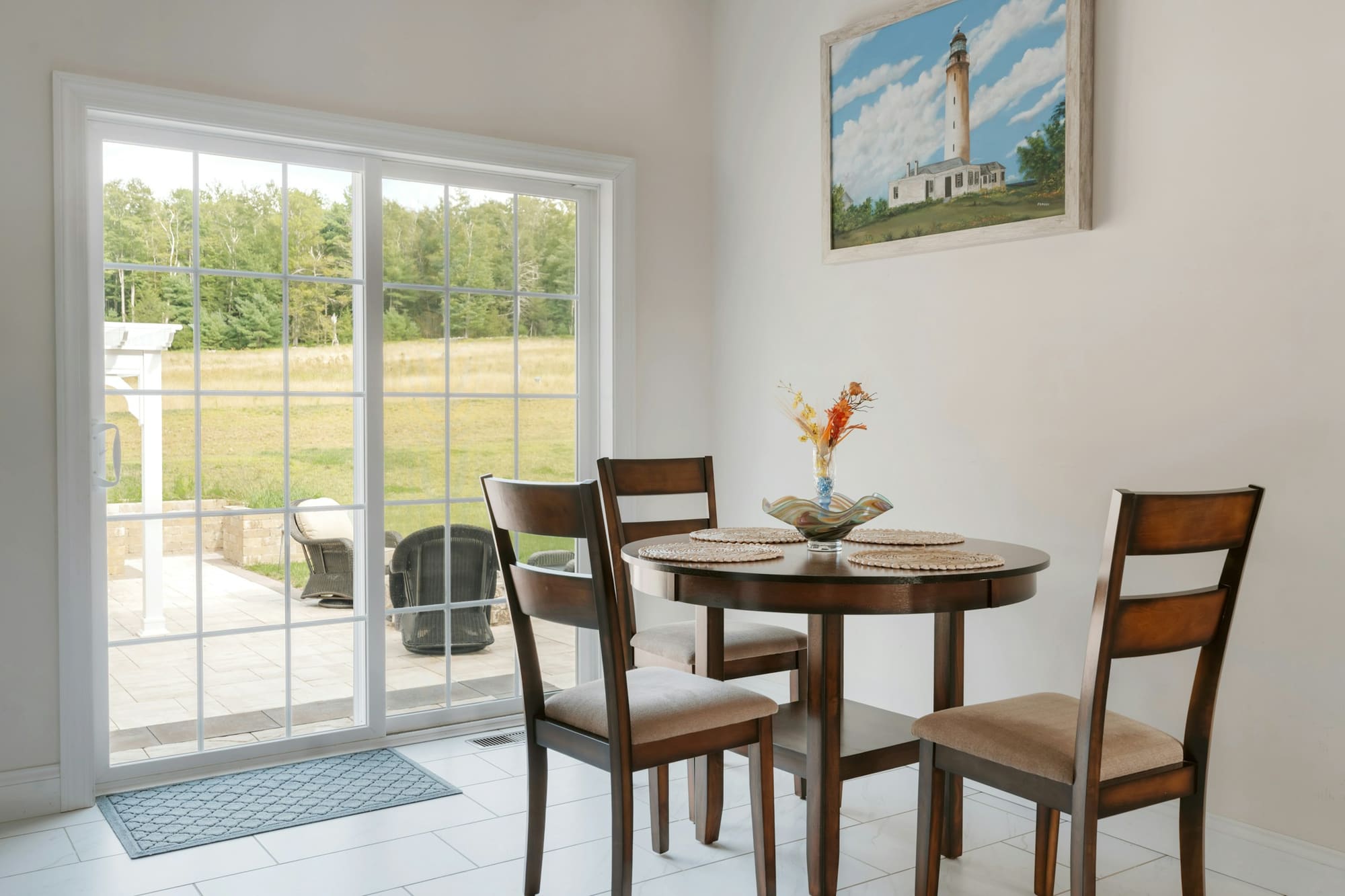 Glass doors opening between an interior room and an outdoor space